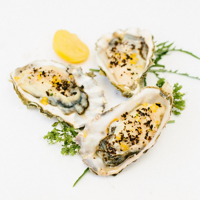 Villa Jerada - Urfa Biber - 50g complements oysters on the half-shell, topped with creamy dressing, breadcrumbs, and herbs, enhancing the dish's complexity with mild spice and smokiness.