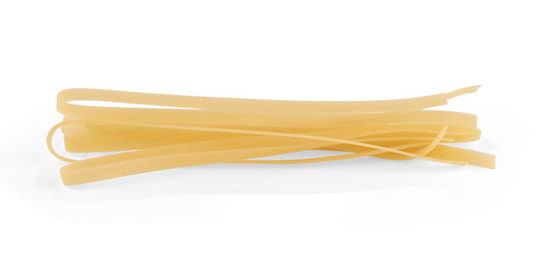 La Fabbrica della Pasta | Gluten Free Fettuccine: A small pile of uncooked flat ribbon pasta, crafted in Gragnano, Italy, offering a satisfying gluten-free al dente texture.