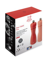 Peugeot | Tahiti Duo Salt + Pepper Mills, Fire: A pair of red-toned, French-made tabletop mills with lifetime-guaranteed steel mechanisms, packaged in Peugeot-branded retail box.