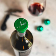 CapaBunga | Holiday Wine Caps - Santa Paws, featuring a close-up of a wine bottle with a green cap, ideal for festive entertaining and gifting.