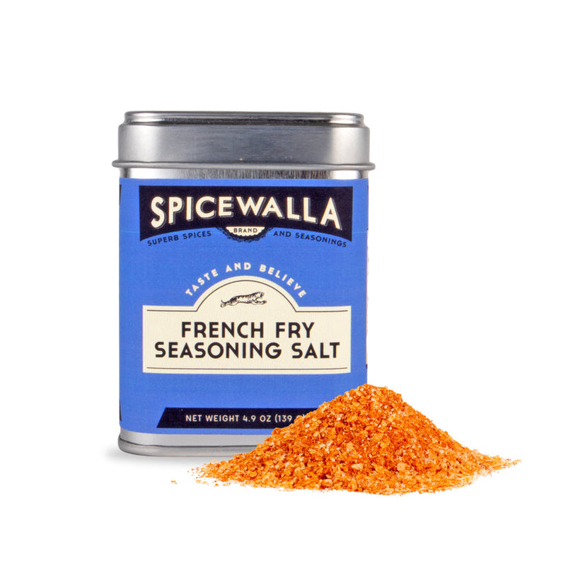 Spicewalla | French Fry Seasoning Salt tin with spilled orange-red seasoning, highlighting its zesty, sweet blend perfect for enhancing various fry styles.