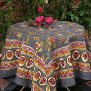 Caravan Home 59 x 86 Pansy Red & Grey Tablecloth featuring intricate floral patterns, elegantly displayed on a set table with decorative elements.