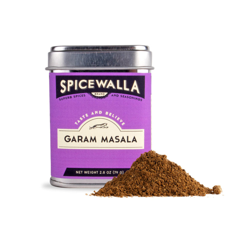 Spicewalla | Garam Masala tin with a mound of aromatic spice blend, featuring nutmeg, clove, and cinnamon, ideal for enhancing roasted vegetables or grilled meats.