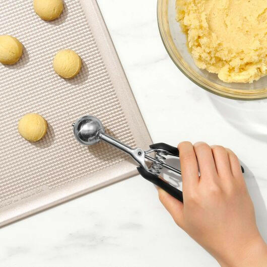 OXO Cookie Scoops - Large, featuring a stainless steel scoop with a soft, non-slip grip handle for easy, uniform dough portioning and smooth release. Ideal for consistent cookie shaping.