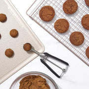 OXO Cookie Scoops - Large, featuring a stainless steel scoop with a spring-loaded handle and soft, non-slip grips for effortless, uniform cookie dough portioning. Dishwasher safe.