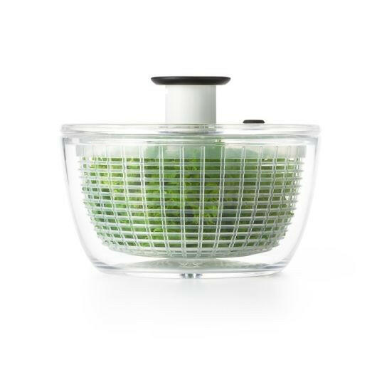 OXO Good Grips Salad Spinner with non-slip base and soft knob, ideal for drying greens. Features a built-in brake, colander function, and compact storage design.