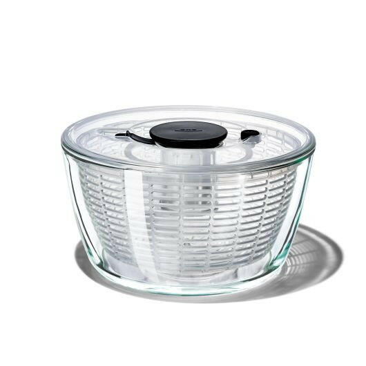 OXO Good Grips Salad Spinner with non-slip knob and base, featuring a dual-purpose spinning basket and compact storage design, ideal for efficient salad preparation.