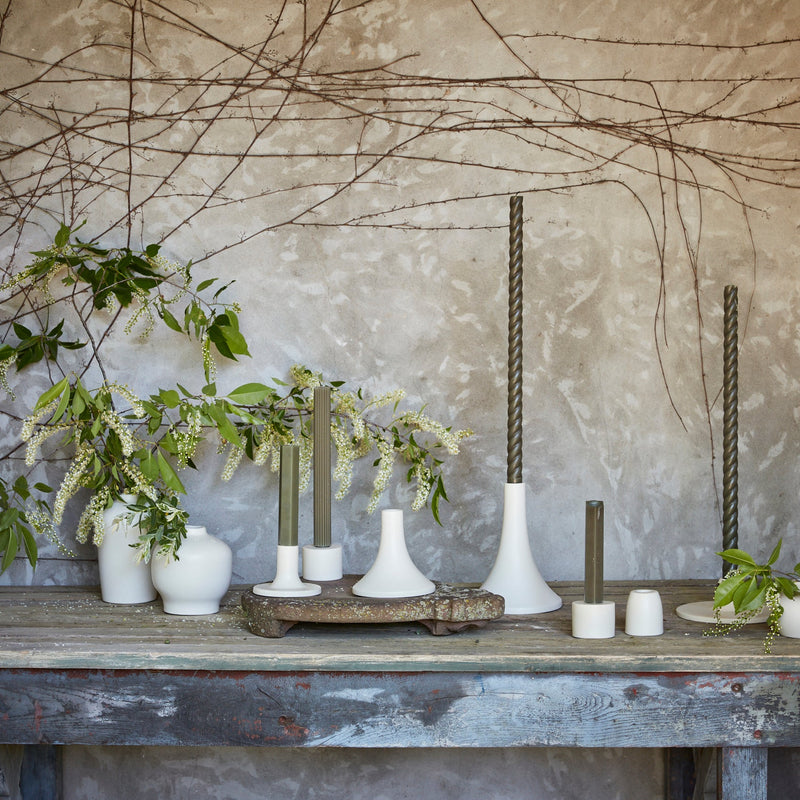 The Floral Society | Candle Holders, Grand, Matte White Tall displayed with olive candles and greenery, showcasing minimalist elegance and handcrafted uniqueness.