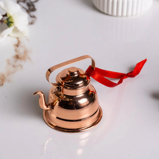 ALFIQ | Handmade Copper Miniature Kitchen Utensil Ornament, Kettle: A polished, tiny copper teapot with a red ribbon, ideal for decoration or as a festive hanging ornament.