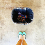 Marley's Monsters Washable Pail Liner - Large, showcasing its water-resistant, durable design with a drawstring closure and versatile cotton strap for convenient hanging.