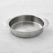 Hestan | OvenBond Round Baker 9 showcased on marble, featuring silver finish and handles, ideal for versatile baking needs at Athens Cooks kitchen store.