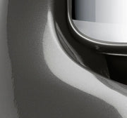 Close-up of Ankarsrum Stand Mixer, showcasing its smooth metal surface and glossy inset, highlighting the appliance's durable design and precision craftsmanship.