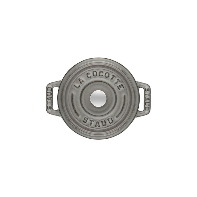 Staub | Mini Round Dutch Oven, Graphite, 0.275 QT: Top view of lid with side handles and central knob, ideal for single-serve culinary creations.