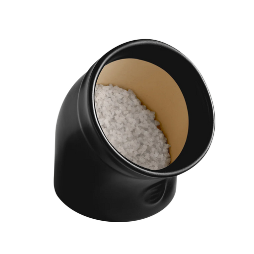 Emile Henry | The Salt Pig: A sleek black container filled with coarse white salt, designed for easy access and clump-free seasoning in your kitchen.