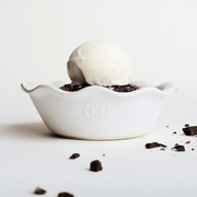 Emile Henry | Modern Classics Mini Pie Dish holds a vanilla ice cream scoop on a brownie base, surrounded by dark chocolate chunks, highlighting its elegant fluted design.