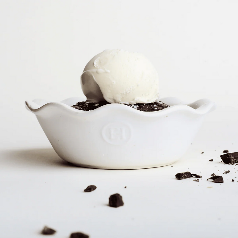 Emile Henry | Modern Classics Mini Pie Dish holds a vanilla ice cream scoop on a brownie base, surrounded by dark chocolate chunks, highlighting its elegant fluted design.