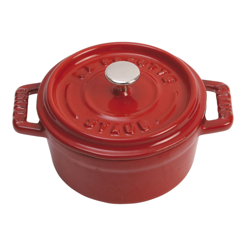Staub | Mini Round Dutch Oven, Cherry, 0.275 QT., featuring a red enameled cast-iron cocotte with handles and embossed lid, ideal for Athens Cooks' curated kitchen collection.
