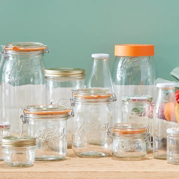 Le Parfait Super Jars - 750ml, showcasing clear glass jars with various lids, perfect for preserving and storage, embodying French durability and elegance.