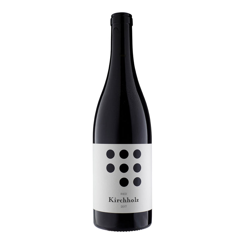 Weninger | 2017 ‘Kirchholz’ Burgenland Blaufränkisch wine bottle, featuring a white label with black dots, showcasing the vineyard's distinct Blaufränkisch grapes' character.