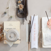 The Floral Society | Essential Oil Incense, Lavender, Lemon Eucalyptus, and Rosemary, elegantly displayed with dried botanicals and a teapot, suggesting a calming ritual.