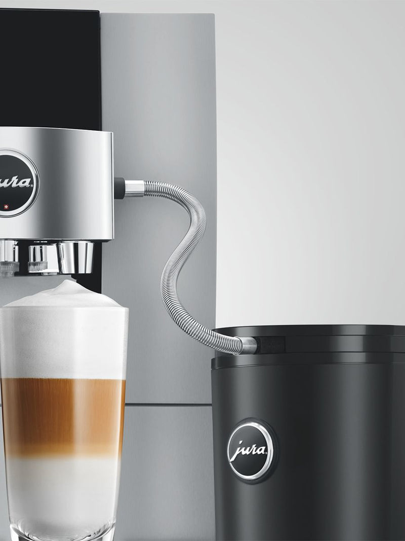 Jura | Stainless Steel Milk Pipe Casing | HP3 connected to a coffee machine, highlighting its elegant stainless steel design and hygienic connection for optimal milk quality.