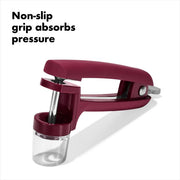 OXO Good Grips Cherry & Olive Pitter in Beet showing non-slip grip and splatter shield for easy and clean pitting of cherries and olives.