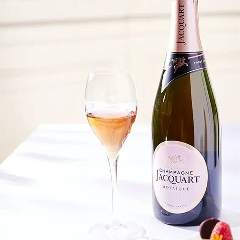 Champagne Jacquart | Brut Cuvée Mosaïques half bottle next to a filled wine glass, showcasing its elegant presentation for Athens, GA pick-up.