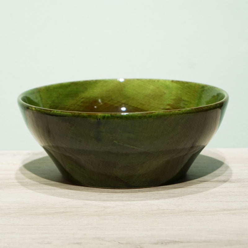 La Gabbianella | LUCCA, Serving Bowl, Olive Green: Handmade ceramic bowl with glossy finish, ideal for serving pasta. Crafted in Italy, resting on a wooden surface.