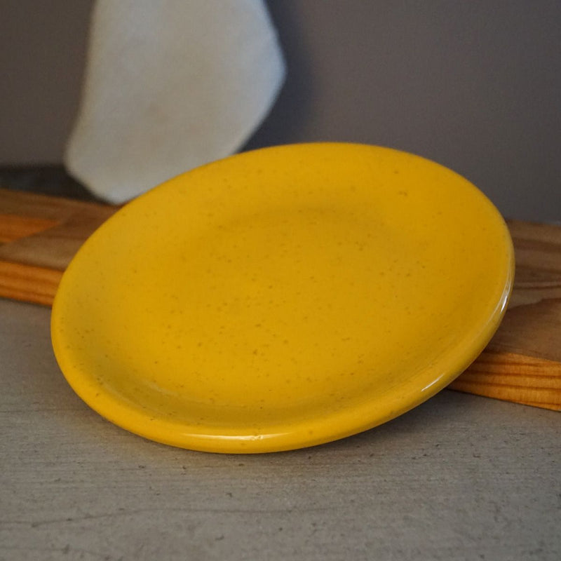 La Gabbianella | PISA, Salad & Dessert Plate, Yellow: Handmade Italian ceramic plate, red clay, microwave and dishwasher safe, displayed on a wooden surface.