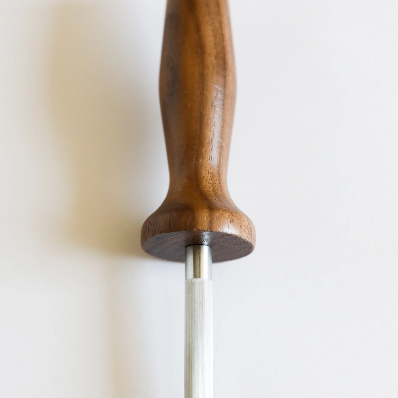 Lamson | Walnut 10 Sharpening Steel, close-up of wood handle and steel rod, essential for maintaining knife sharpness in culinary tasks.