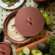 Sir|Madam Terra Cotta Larder Crock No. 10 partially open, revealing tortillas. Surrounded by fresh taco ingredients like avocados, limes, and cilantro on a tiled surface.