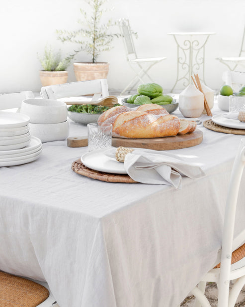 MagicLinen's 59 x 98-inch linen tablecloth with simple seam finish, ideal for versatile dining settings at Athens Cooks.