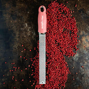 Microplane Premium Zester, Grater - Classic Blue shown with red berries, ideal for precise zesting and grating, favored by chefs and home cooks.