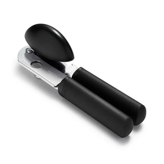 OXO Soft-Handled Can Opener with large cushioned handles, oversized knob, and stainless steel cutting wheel for easy can opening; includes a built-in bottle opener.
