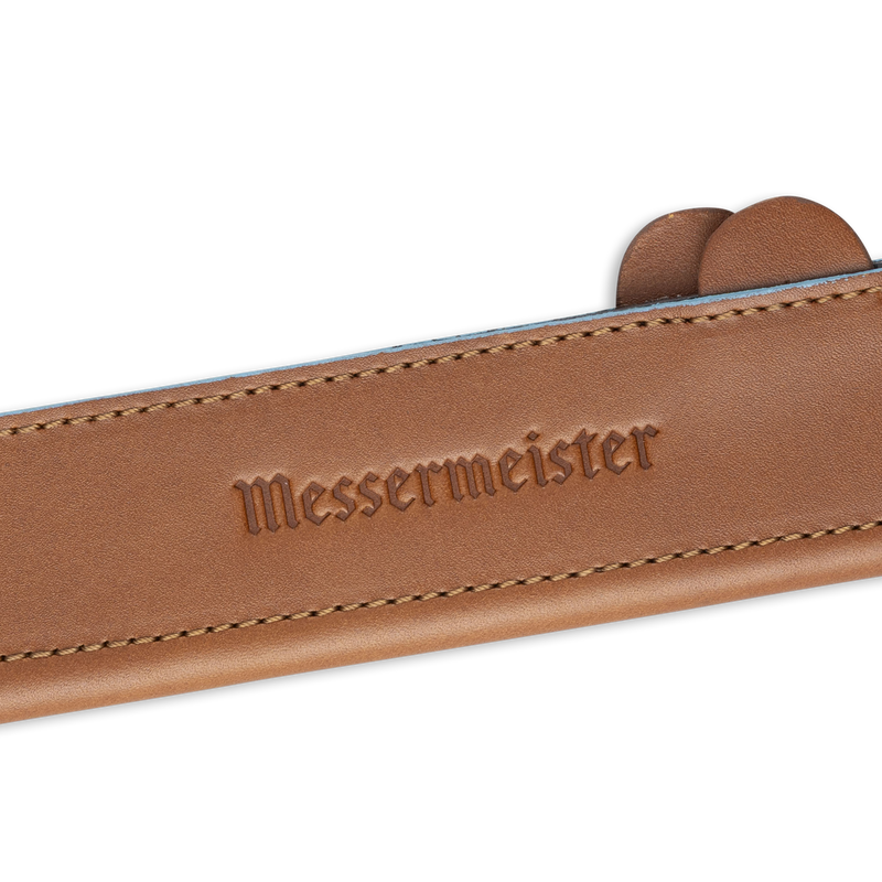 Messermeister Leather Magnetic Edge Guard, 6.5 inches, Brown, showing embossed brand and partial knife handles, offers stylish, durable protection for utility or boning knives.
