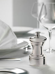 Peugeot | Mignonnette Vintage Silver Plated Pepper Mill 10 Cm - 4in. on table, showcasing elegant silverware design with historic craftsmanship.