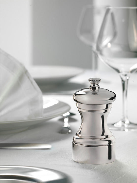 Peugeot | Mignonnette Vintage Silver Plated Pepper Mill 10 Cm - 4in. on table, showcasing elegant silverware design with historic craftsmanship.
