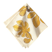 Caravan Home Fig Citrine Napkins Set of 6, featuring handprinted citrine figs and leaves on French linen, enhancing any table setting.