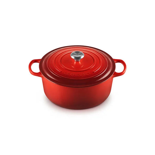 Le Creuset Signature Oval Dutch Oven, 8 QT, Cerise, featuring side handles and a snug lid for excellent heat retention and moisture trapping, ideal for cooking.