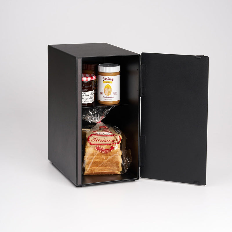 Yamazaki Home | Bread Box, Vertical, Steel, Black, showcasing two jars of spread and a loaf of bread, offering stylish storage for fresh baked goods.