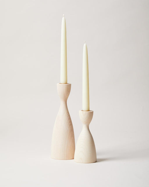 Farmhouse Pottery | Pantry Candlesticks - Small White: Two handcrafted, turned-wood candle holders with slender taper candles, showcasing elegant, timeless design perfect for dining or mantel displays.
