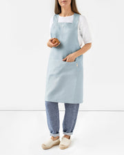 MagicLinen Pinafore Cross-Back Linen Apron, S-M, featuring criss-cross straps and side pockets for practical cooking or gardening use.