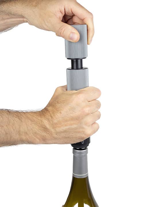 Peugeot | Preserve Duo - Carbon is used to open a bottle of wine, showcasing its functionality in enhancing wine preservation and serving.