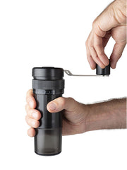 Hands using Peugeot | Presto Coffee Mill, 8 inches, with adjustable grind settings for various coffee preparations, perfect for espresso, filter, piston, or cold brew methods.