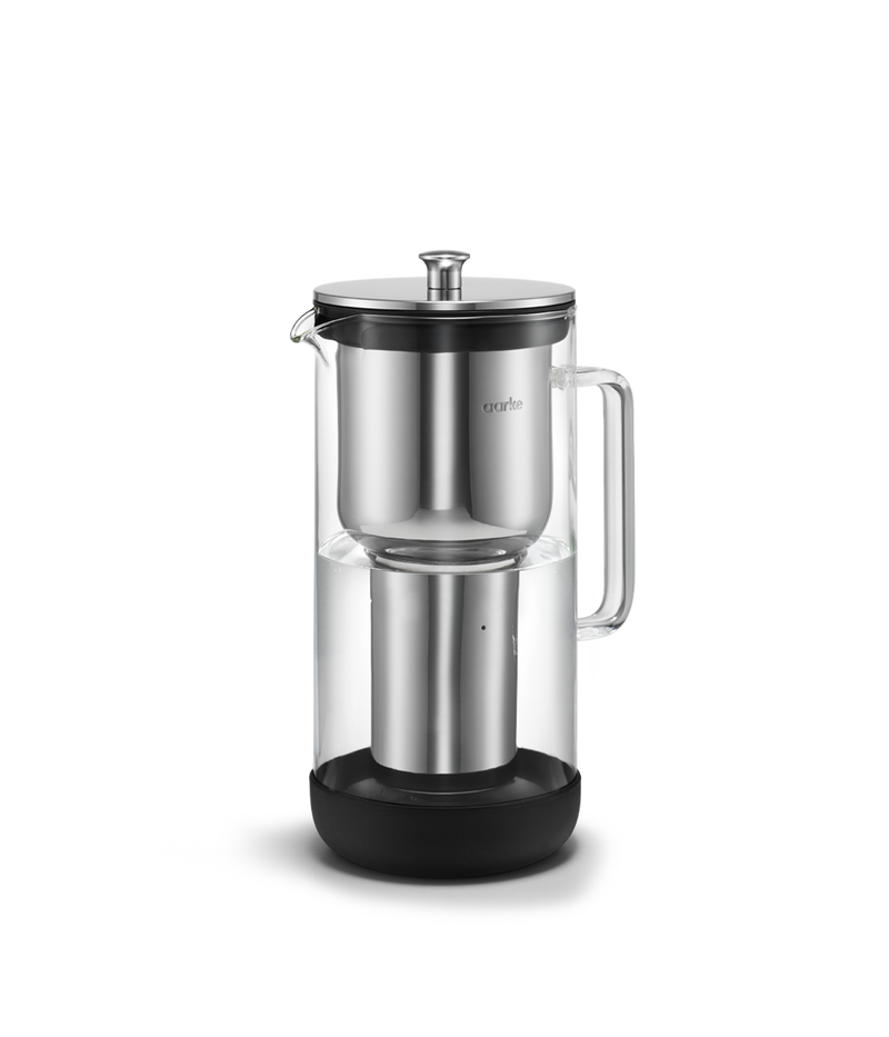 Aarke | Purifier Pure Water Filter Pitcher made of glass and stainless steel, featuring a refillable steel filter cartridge for enhanced tap water filtration.