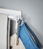 Yamazaki Home Magnetic Kitchen Towel Hanger, Steel, White, holds two towels with removable hooks, featuring a magnetic mount for easy kitchen use.
