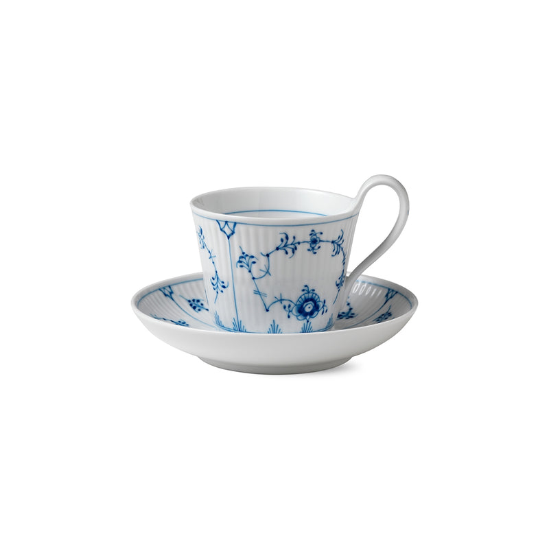 Royal Copenhagen | Blue Fluted Plain Cup and Saucer 24cl, featuring a high handle and elegant blue floral design on a ribbed surface. Ideal for sophisticated tea or coffee moments.