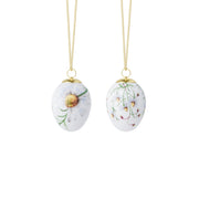 Royal Copenhagen | Spring 2026 Eggs Chamomile 6cm 2pc, featuring hand-painted daisy motifs on porcelain, suspended by gold cords, perfect for springtime decoration.