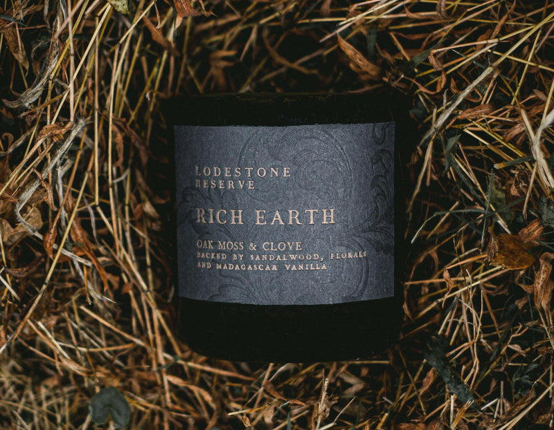 Lodestone | Luxury Soy Candles - Winterberry & Cypress label on vintage letterpress, showcasing its artisanal craftsmanship and decorative potential.