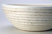 Breadtopia | Round Rattan Bread Proofing Basket and Liner, designed for shaping dough, highlighting quality craftsmanship by the Nguyen family in Vietnam.